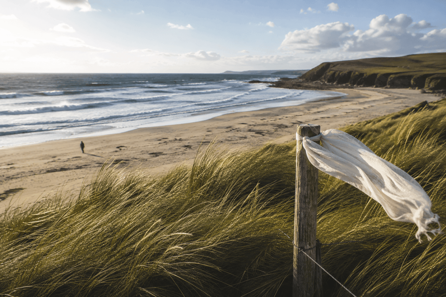 Turquoise coastline with wind-carved sand dunes